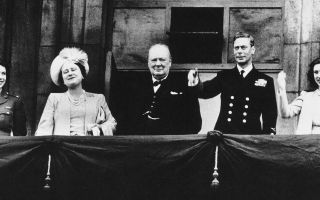 Princess Elizabeth, Queen Elizabeth the Queen Mother, Winston Churchill, King George VI and Princess Margaret on the Buckingham Palace balcony on VE Day 1945