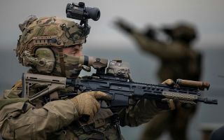 Commandos from the Special Operations Maritime Task Group practise and develop their Maritime Interdiction skills using RFA Lyme Bay as the target vessel