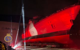 HMS Active emerges from her build hall during a ceremony in Rosyth Dockyard