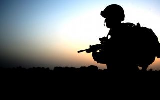 A soldier is pictured returning from a patrol around the village of Zarghun Kalay, Afghanistan in May 2009 (Picture: MOD)