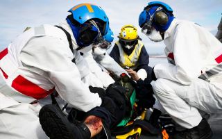Medical teams treat a simulated casualty during a crash-on-deck exercise on the flight deck of HMS Queen Elizabeth (Picture: MOD)