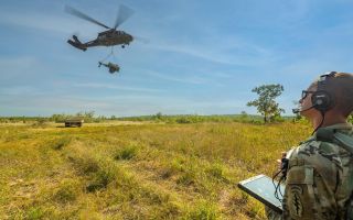 The unnamed sergeant in the US Army National Guard controls the helicopter with his tablet