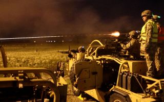 The reservists light up the night sky with tracer rounds as they take part in one of the key phases of the Platform Weapon Operators Course