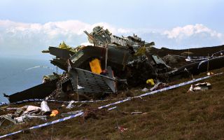 After hitting the hillside, the bulk of the helicopter remained airborne for 187 metres before coming to rest in pieces (Picture: Alamy)