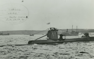 HMS Urge Admiralty old black and white post card with a bird flying 