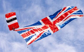 The Army's Red Devils parachute display team fly the flag at the Armed Forces Day national event in Aldershot (Picture: MOD)