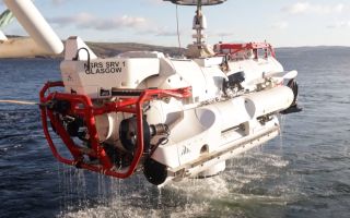 Nato Submarine Rescue Service submersible Nemo is hoisted out of the water during the exercise