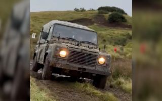 A Land Rover tackles a section on one of the challenging courses