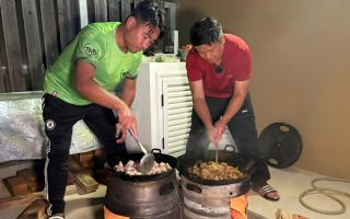 Two pots of Gurkha curry are prepared for the hungry guests