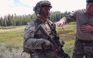 This Royal Marine is kitted out to spend up to 24 hours in mountainous terrain