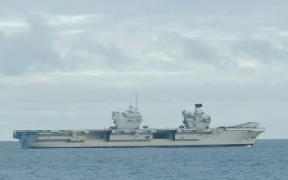 The 65,000-tonne aircraft carrier docked in Namsos, a town in Norway, to receive supplies (Picture: Forsvaret)