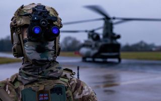 A special operations soldier from 4th Battalion, The Ranger Regiment works with a Chinook at RAF Leeming during the two-week Exercise Hyperion Storm