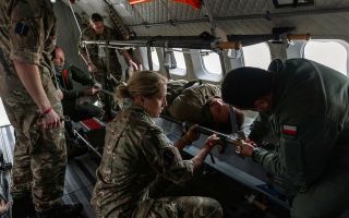 The RAF's Medical Team and Polish medics load a casualty onto an aircraft during an aero casualty evacuation (casevac) on Exercise Vigorous Warrior (Picture: MOD)