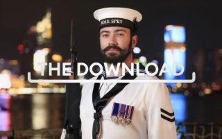 One of HMS Spey's guard stands smartly to attention on the patrol ships flight deck during a reception Download TN CRED MOD