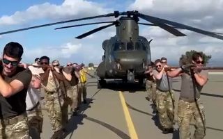 RAF Akrotiri personnel pulled the Chinook 1,310 feet for the veterans charity (Picture: MOD)