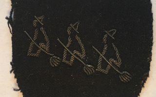 CROPPED 16 x 9 Three Witches on Broomsticks emblem was used by Intelligence School 9, part of MI9, during their covert operations in Holland, 1944 CREDIT Dr Helen Fry