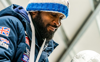 Corie Mapp looking at trophy