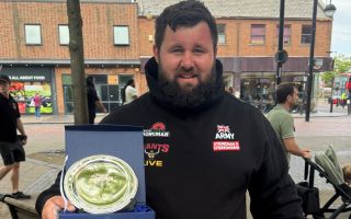 Corporal Rhys Calland of British Army with 3rd place trophy for Ultimate Strongman