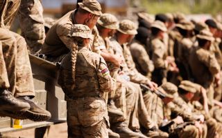 Female soldiers from 1st Battalion The Royal Welsh sit on deployable bridging during a drill on the Drawsko Pomorskie Training Area in Poland on Ex Steadfast Defender 090125 CREDIT MOD