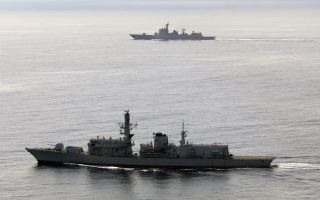 HMS Richmond (foreground) accompanies Chinese destroyer Jiaozuo through the English Channel 100824 CREDIT Royal Navy