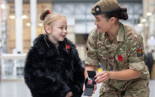 Ivy Knighton-Leake, one of the country’s youngest Poppy Appeal collectors, launches 2026 campaign with Private Katie Brazier of the Royal Anglian Regiment 221026 CREDIT Royal British Legion