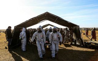 Marines from 40 Commando’s Bravo Company and experts from the Defence Science and Technology Laboratory (Dstl) on Exercise Toxic Dagger - the UK’s largest exercise focused on chemical, biological, radiological and nuclear (CBRN) warfare (Picture: MOD)