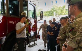 Personnel from HMS Trent are briefed in Tampa's fire rescue HQ (Picture: Royal Navy)