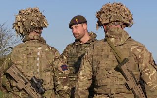 Prince William chats with Welsh Guards on Salisbury Plain