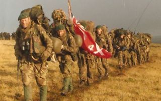 Royal Marines yomp across the Falklands in an effort to capture the Two Sisters (Picture: Alan Roberts).