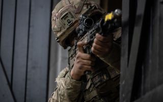 A soldier fires during exercise iron cyclone 2023