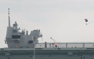 Parachutists land on HMS Queen Elizabeth's flight deck