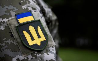 Ukrainian soldier listens as The Minister of State for the Armed Forces Luke Pollard CREDIT MOD.jpg