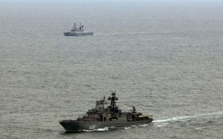 HMS Duncan tracks Admiral Kulakov in the foreground, as it transited through the English Channel