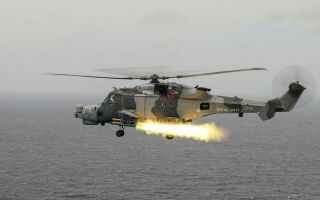 Wildcat helicopter with 815 NAS firing Martlet missiles in Bay of Bengal