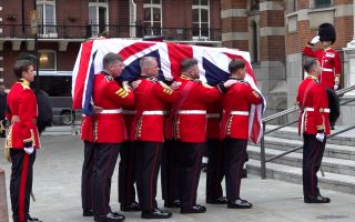 Field Marshal Lord Guthrie's coffin is carried into Westminster Cathedral