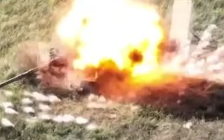 Russian Turtle tank being hit by a Ukrainian drone