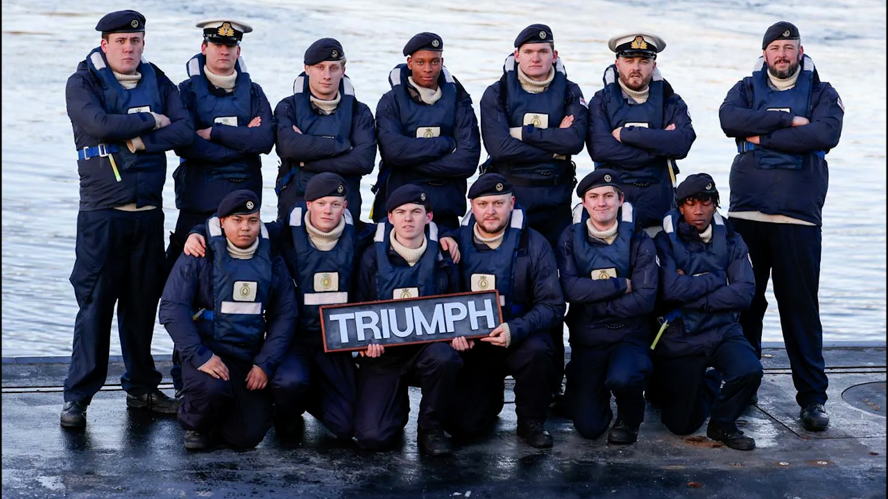 The crew of HMS Triumph pictured on the submarine ahead of its decommissioning (Picture: Royal Navy)