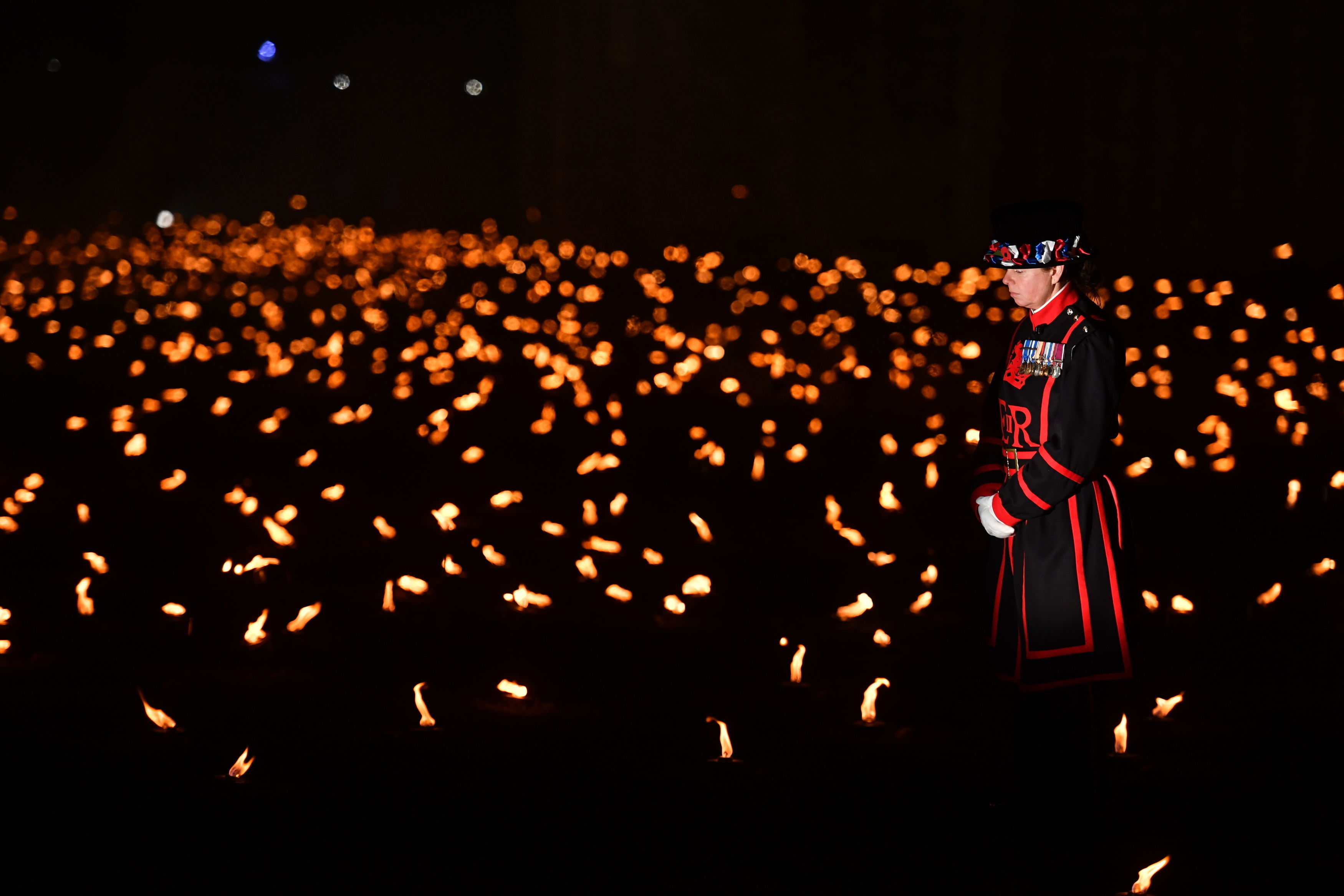 Thousands of flames have been lit around the Tower of London, to remember all those lost in the First World War, and in every conflict since (Picture: PA).