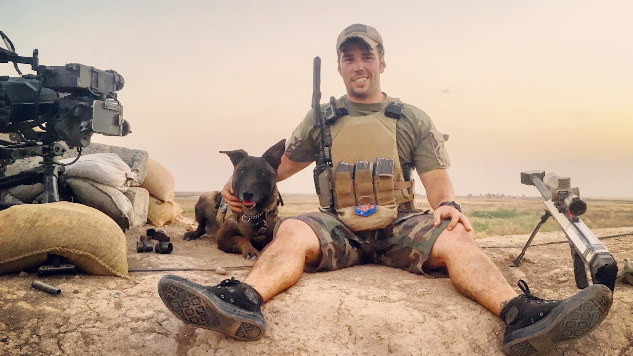 MPC Shimanski pictured with his handler Marine Staff Sergeant Brandon Marquez, who later adopted him (Picture: US Marine Corps).