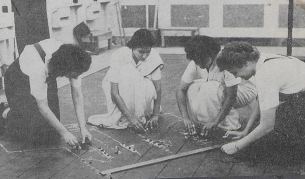 women in the WRINS doing plotting work during the Second World War